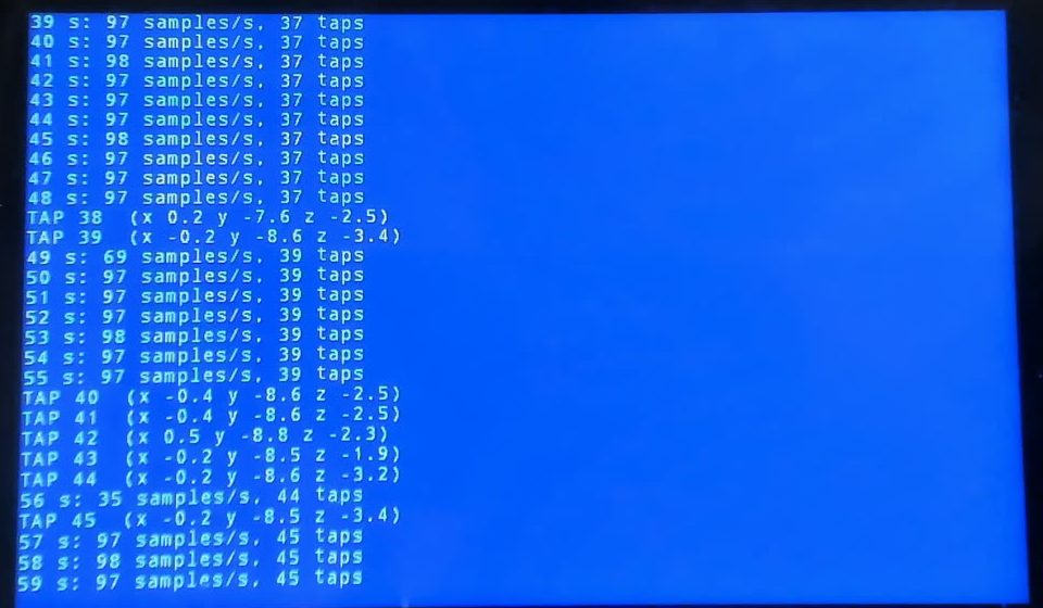 Console counting about 97 samples per second and listing detected taps with acceleration values