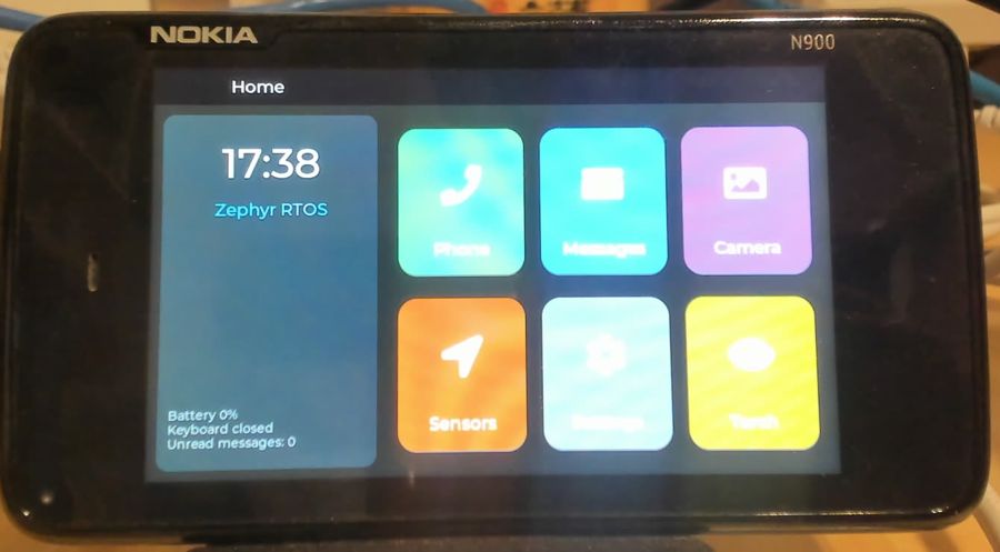Home screen with clock and six app tiles