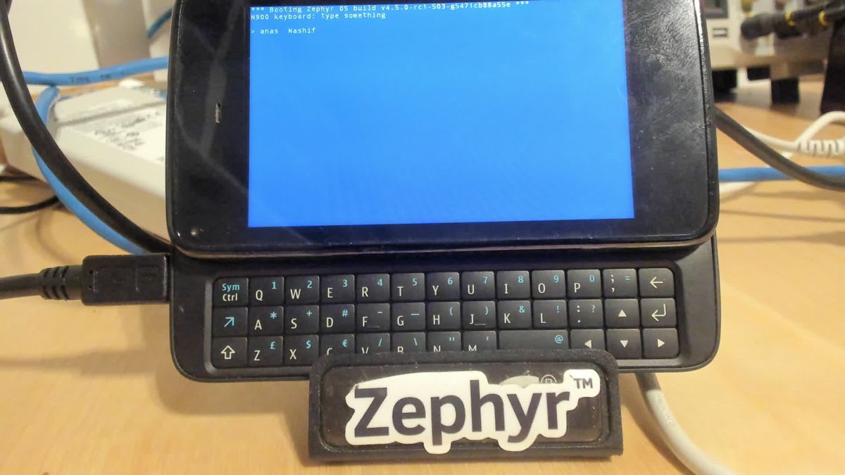 N900 with keyboard slid out, screen showing the typed text anas Nashif