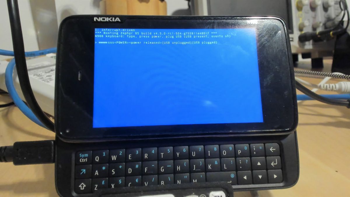 N900 console showing typed keys, POWER press and release, USB unplugged and plugged